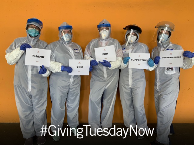 Nurses in PPE and Gowns holding signs that read thank you for supporting humankindness