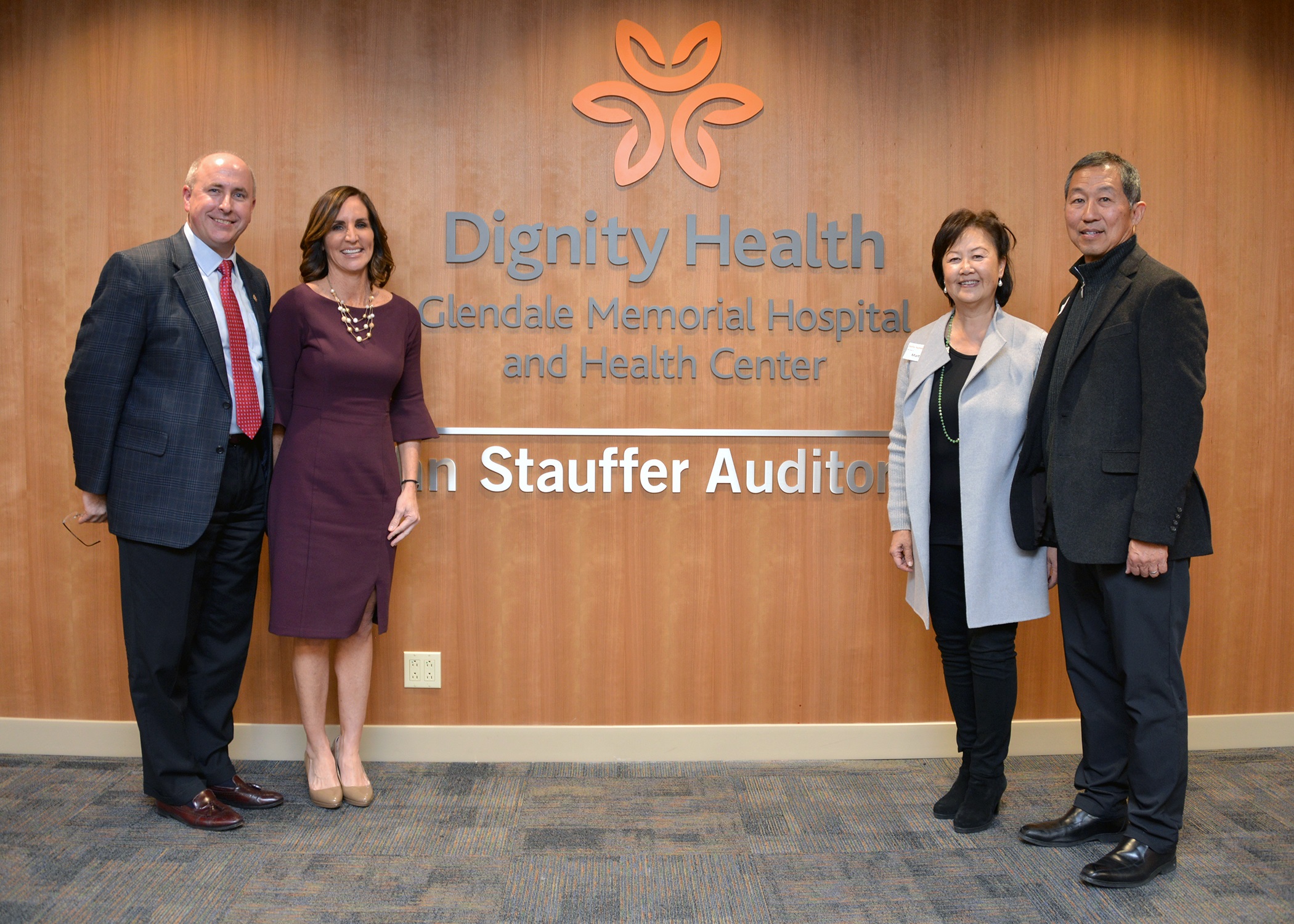 State of the Hospital Event Photo with four adults looking at camera