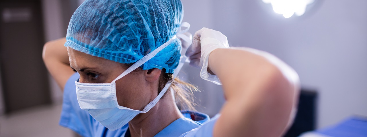 Caregiver putting mask on 