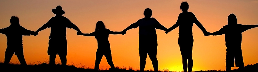 Silhouettes of people holding hands